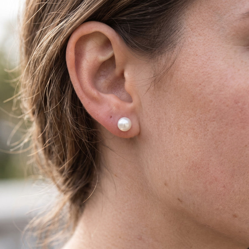 6mm white pearl studs worn